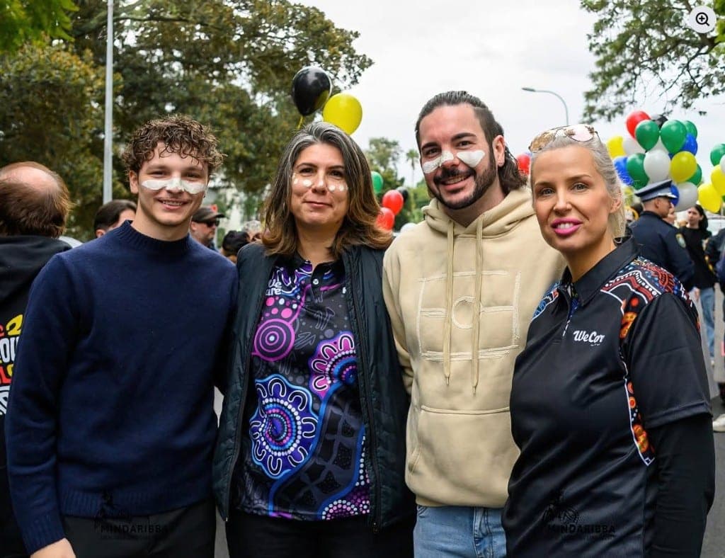 We Care NSW team members smiling together at a community event